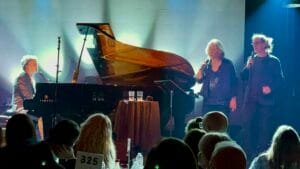 Photo of Rufus Wainwright, Sloan Wainwright, and Glen Roethel on stage at The Birchmere in Alexandria, VA